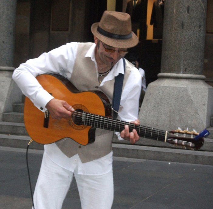 A guitarist and violinist from the Balkan Duo playing in Sydney, Australia (image)